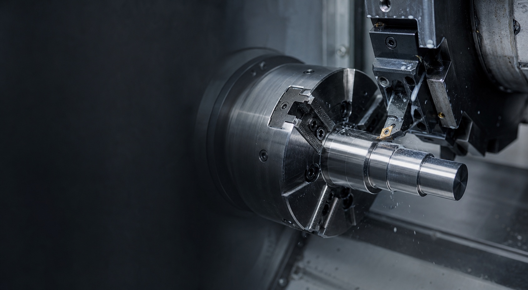 CNC turning center machining a stainless-steel cylindrical component
